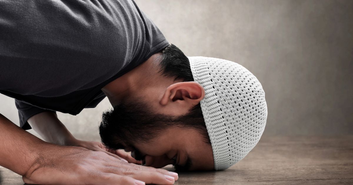 A muslim man performing prostration in salah