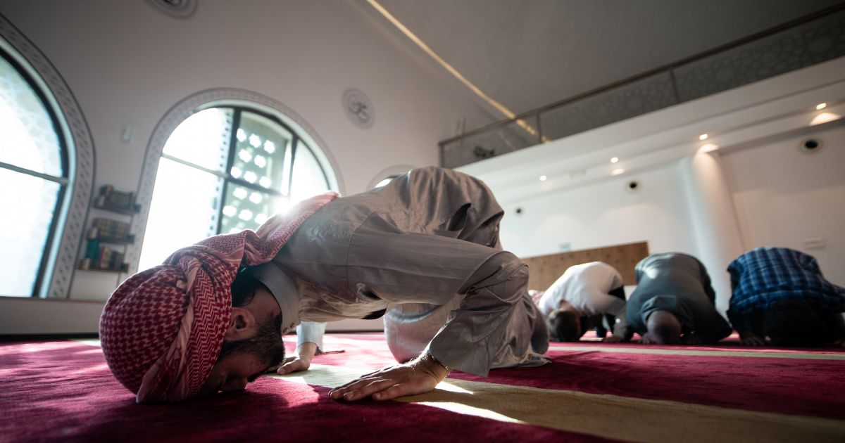 A Muslim man doing prostration during Muslim prayer