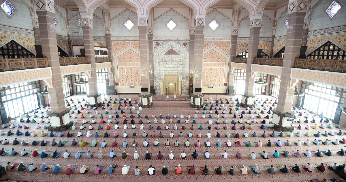 Muslims praying in congregation during pandemic in the mosque